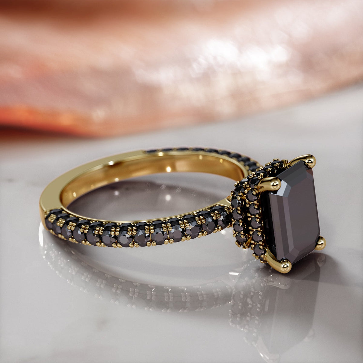Oscura Magia yellow gold ring, side view of the black diamond double hidden halo and pavé band