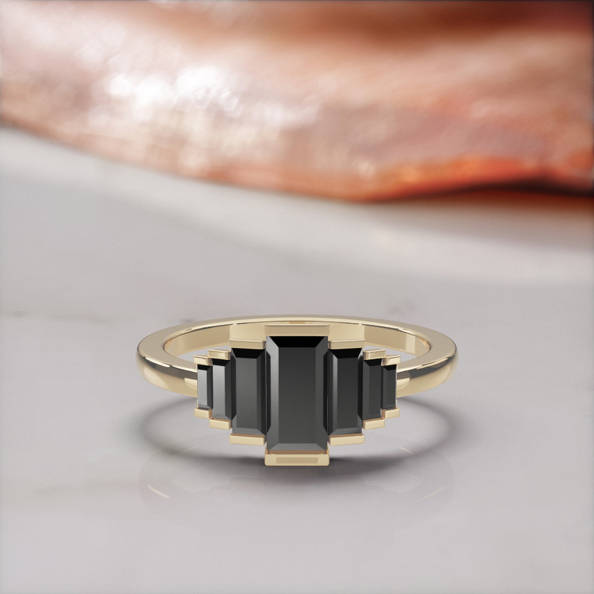 Pleiades graduated baguette natural black diamond ring in yellow gold, front view