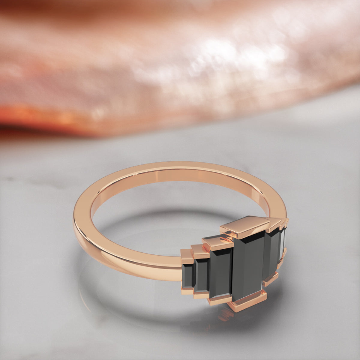 Pleiades graduated baguette natural black diamond ring in rose gold, three-quarter view