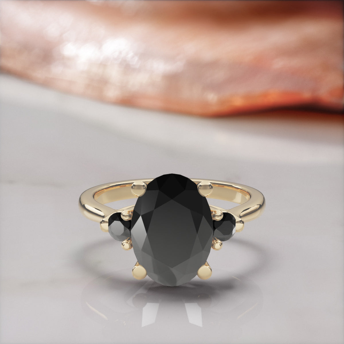 Centauri oval natural black diamond engagement ring with round side stones in yellow gold, front view