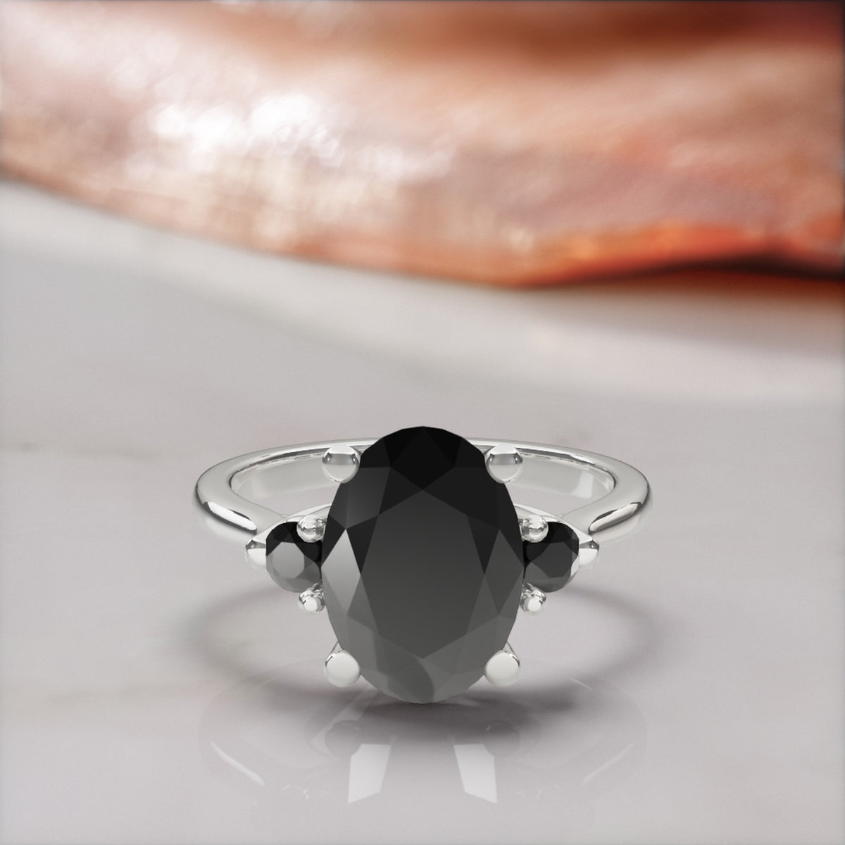 Centauri oval natural black diamond engagement ring with round side stones in white gold, front view