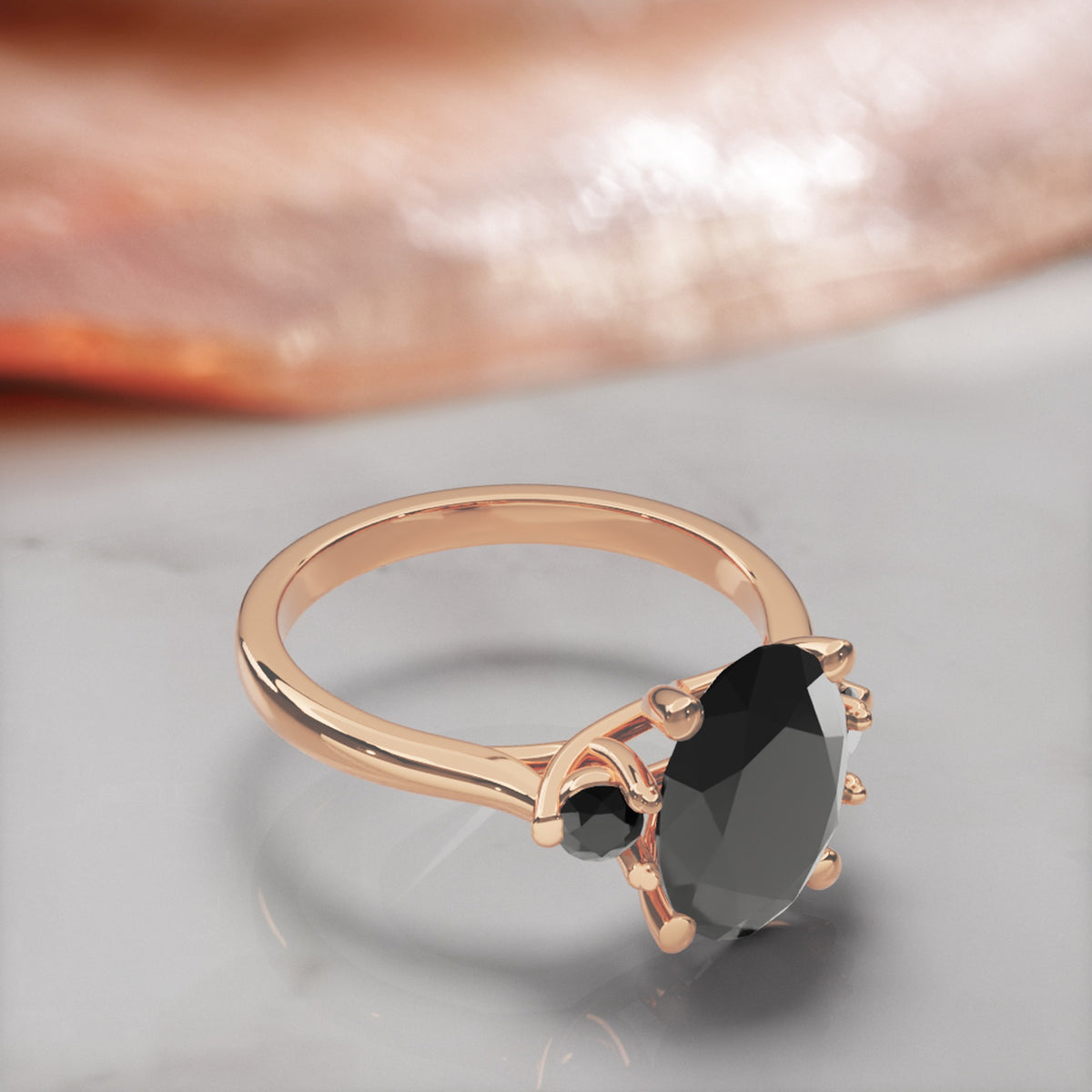 Centauri oval natural black diamond engagement ring with round side stones in rose gold, three-quarter view