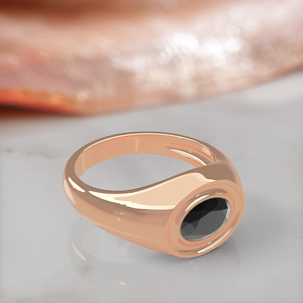 Algol east-west oval natural black diamond bezel ring in rose gold, three-quarter view