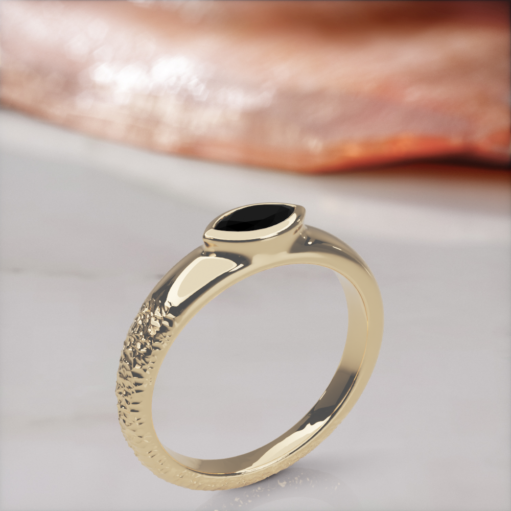 Disturbed engagement ring in yellow gold standing upright, three-quarter view of the rough and polished halves of the band